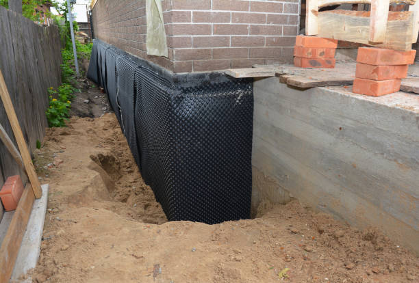 Happy homeowners after waterproofing job in Shelbyville